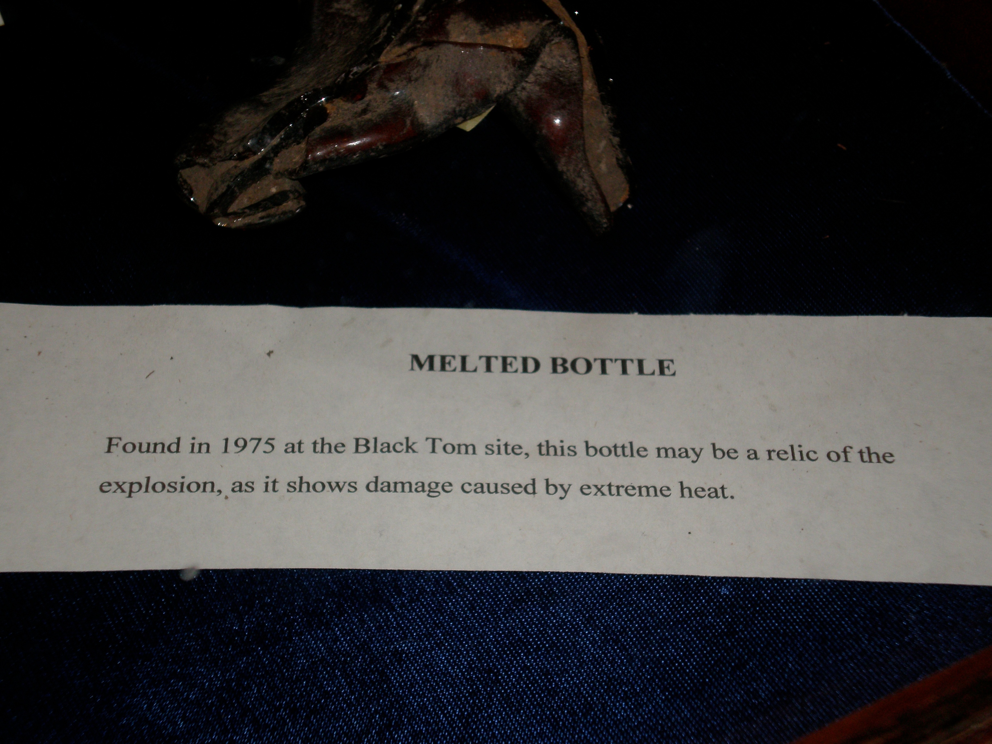 Black Tom Melted Bottle